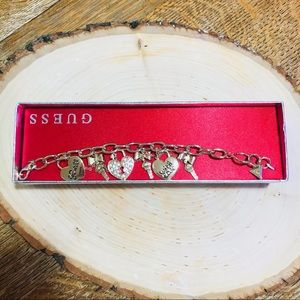 Guess brand gold tone rhinestone charm bracelet